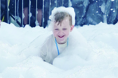 Children playing in foam at Dippy's Foam Zone