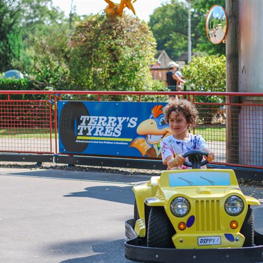 Child driving a Dippy's Raceway car at ROARR!