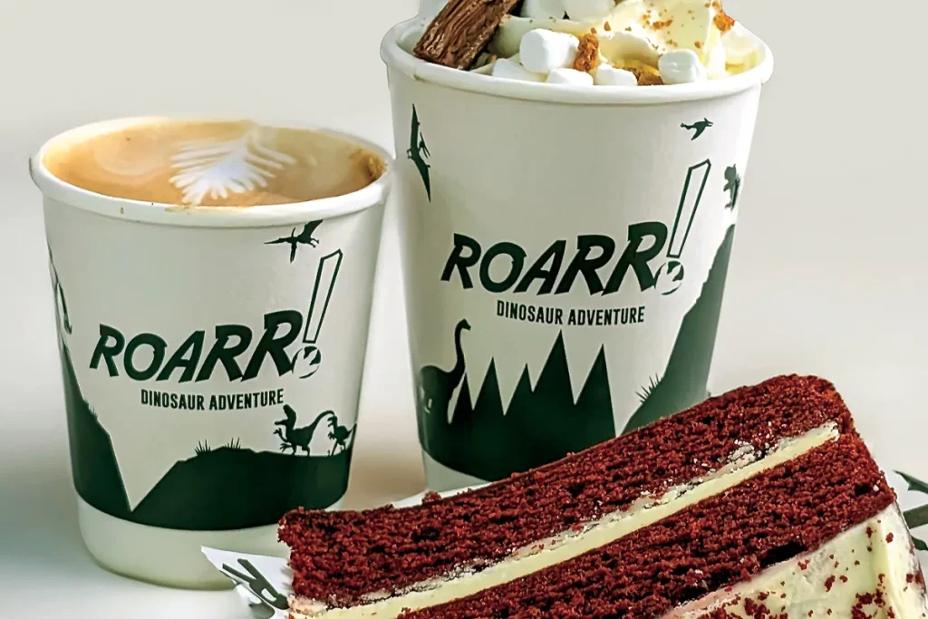 ROARR! branded coffee, hot chocolate with marshmallows and a slice of red velvet cake